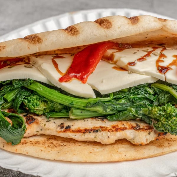 Angelo's Pizzeria's chicken sandwich with broccoli rabe, mozzarella, and roasted red peppers.